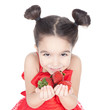 Little girl with strawberry on white background