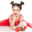 Little girl with strawberry on white background