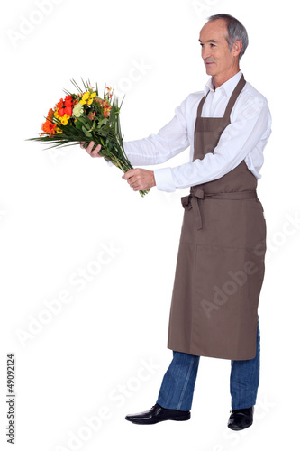 Photo: A mature florist. A mature florist.