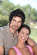 Couple hugging in park