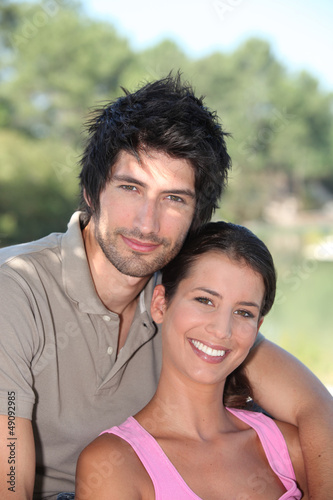 Photo: Couple hugging in park Couple hugging in park