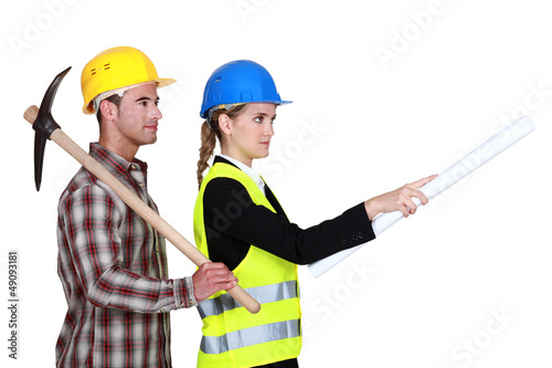 Photo: picture of young female architect with male bricklayer picture of young female architect with male bricklayer