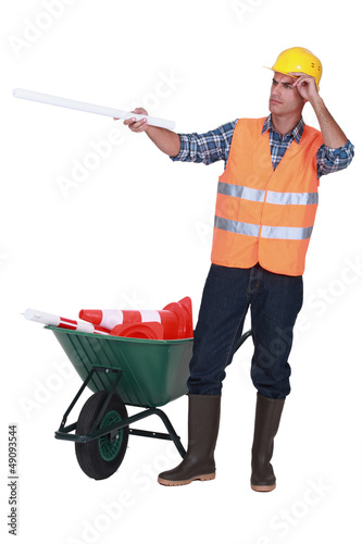 Photo: Road worker with a barrow full of cones Road worker with a barrow full of cones