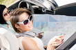 Photo: Girls lost their way and check the way with the help of the map Girls lost their way and check the way with the help of the map