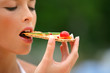 Photo: Woman eating healthy cracker snack Woman eating healthy cracker snack