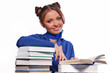 girl sitting in front of books