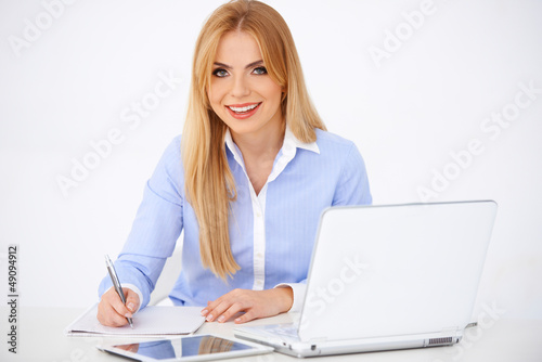 Photo: Blond girl with laptop Blond girl with laptop