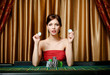 Photo: Woman with chips sitting at the roulette table Woman with chips sitting at the roulette table