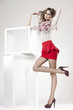 beautiful woman with long sexy legs dressed elegant - studio