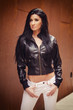 Beautiful young woman in leather jacket