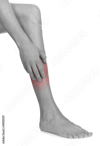 Photo: Women scratch itchy leg with hand. Women scratch itchy leg with hand.
