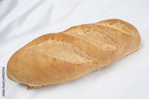 Photo: Loaf of bread on white background Loaf of bread on white background