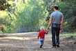 father and daughter in the spring forest