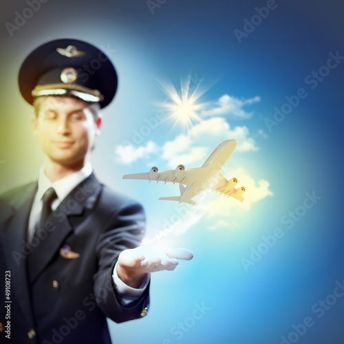 Photo: Image of pilot with plane in hand Image of pilot with plane in hand