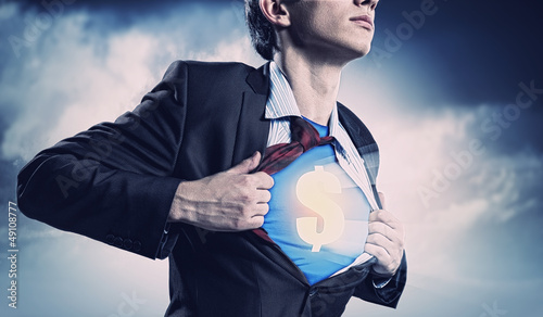 Photo: Businessman showing superman suit underneath shirt Businessman showing superman suit underneath shirt