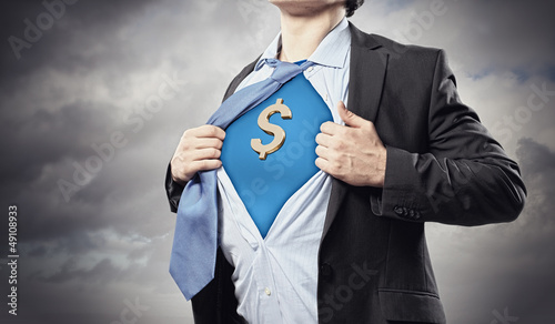 Photo: Businessman showing superman suit underneath shirt Businessman showing superman suit underneath shirt
