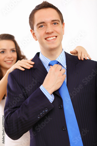 Photo: Businessman dressing at home in the morning Businessman dressing at home in the morning