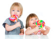 Photo: Babies eating a sticky lollipop Babies eating a sticky lollipop