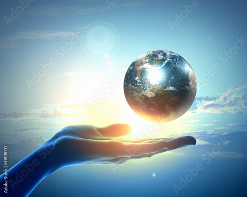 Photo: Image of earth planet on hand Image of earth planet on hand