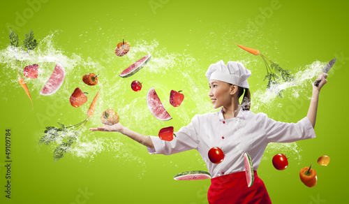 Photo: Asian female cook with knife Asian female cook with knife