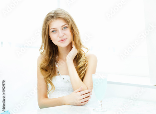 Photo: Young woman in cafe Young woman in cafe