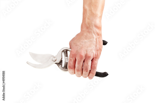 Photo: Garden scissors in hand isolated on a white background Garden scissors in hand isolated on a white background