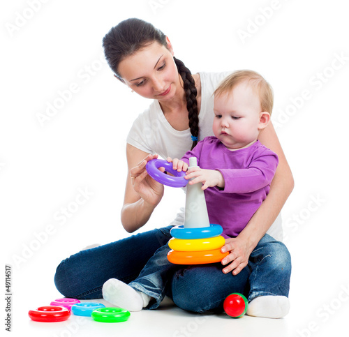 Photo: baby girl and mother playing together with toy baby girl and mother playing together with toy