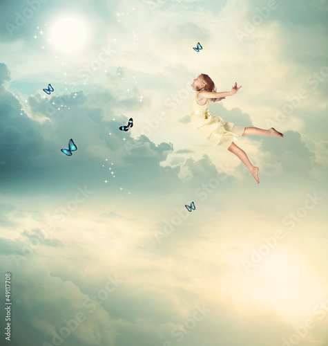 Photo: Little Girl Flying at Twilight Little Girl Flying at Twilight