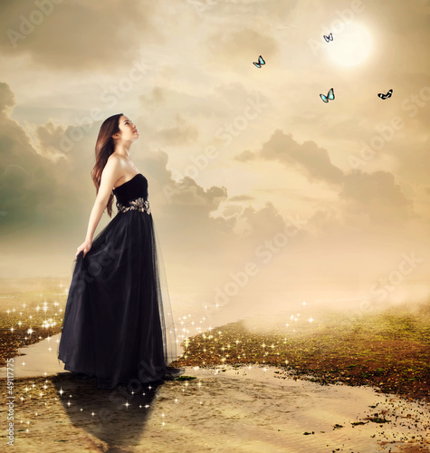 Photo: Beautiful girl at a brook under the moon light Beautiful girl at a brook under the moon light