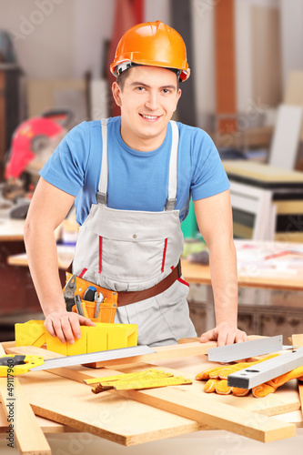 Photo: Carpenter working in a workshop Carpenter working in a workshop