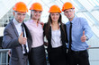 People in helmets on a construction site