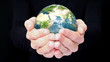 Earth in hands.