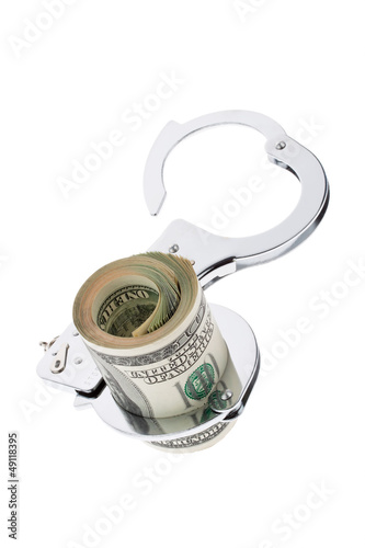 Photo: Dollar Geldscheine mit Handschellen Dollar Geldscheine mit Handschellen