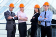 People in helmets on a construction site