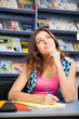 Beautiful female student in a university library