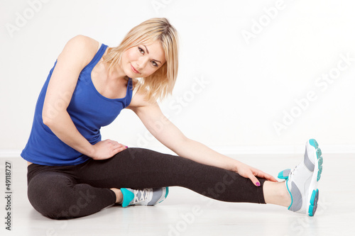 Photo: Slim woman exercising in a gym Slim woman exercising in a gym