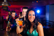 Foto: People with cocktails in bar or club People with cocktails in bar or club