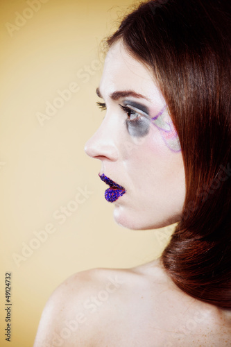 Photo: portrait of young beautiful woman creative make up portrait of young beautiful woman creative make up