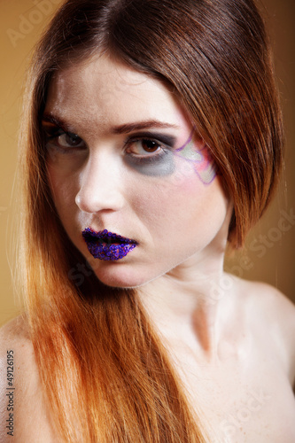 Photo: portrait of young beautiful woman creative make up portrait of young beautiful woman creative make up