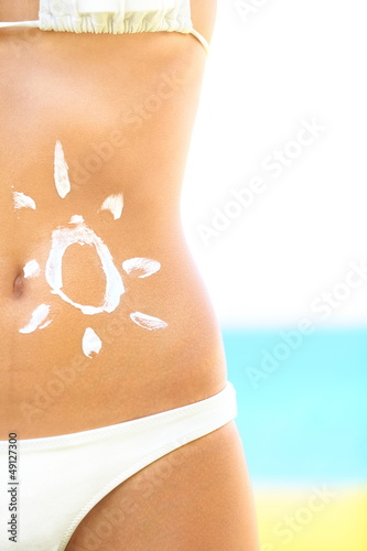 Photo: Sunscreen / sunblock woman Sunscreen / sunblock woman