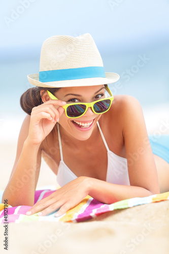 Photo: Woman on beach with sunglasses Woman on beach with sunglasses