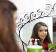  woman with cup of medicine gargling