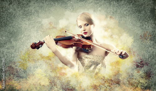 Photo: Gorgeous woman playing on violin Gorgeous woman playing on violin
