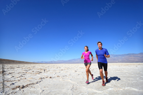 Photo: Athletes running sport fitness couple outdoor Athletes running sport fitness couple outdoor