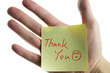 hand showing a post-it to thank you