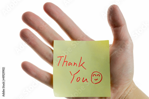Photo: hand showing a post-it to thank you hand showing a post-it to thank you