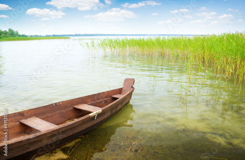 Photo: boat on the bank of lake boat on the bank of lake