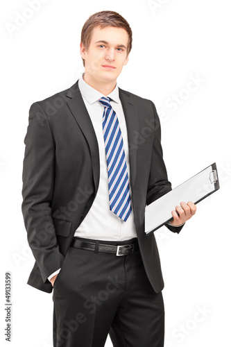 Photo: Busniessman posing with clipboard Busniessman posing with clipboard