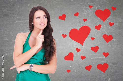 Photo: woman wondering how is it to be in love woman wondering how is it to be in love