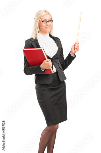 Photo: Young teacher holding a folder and posing Young teacher holding a folder and posing